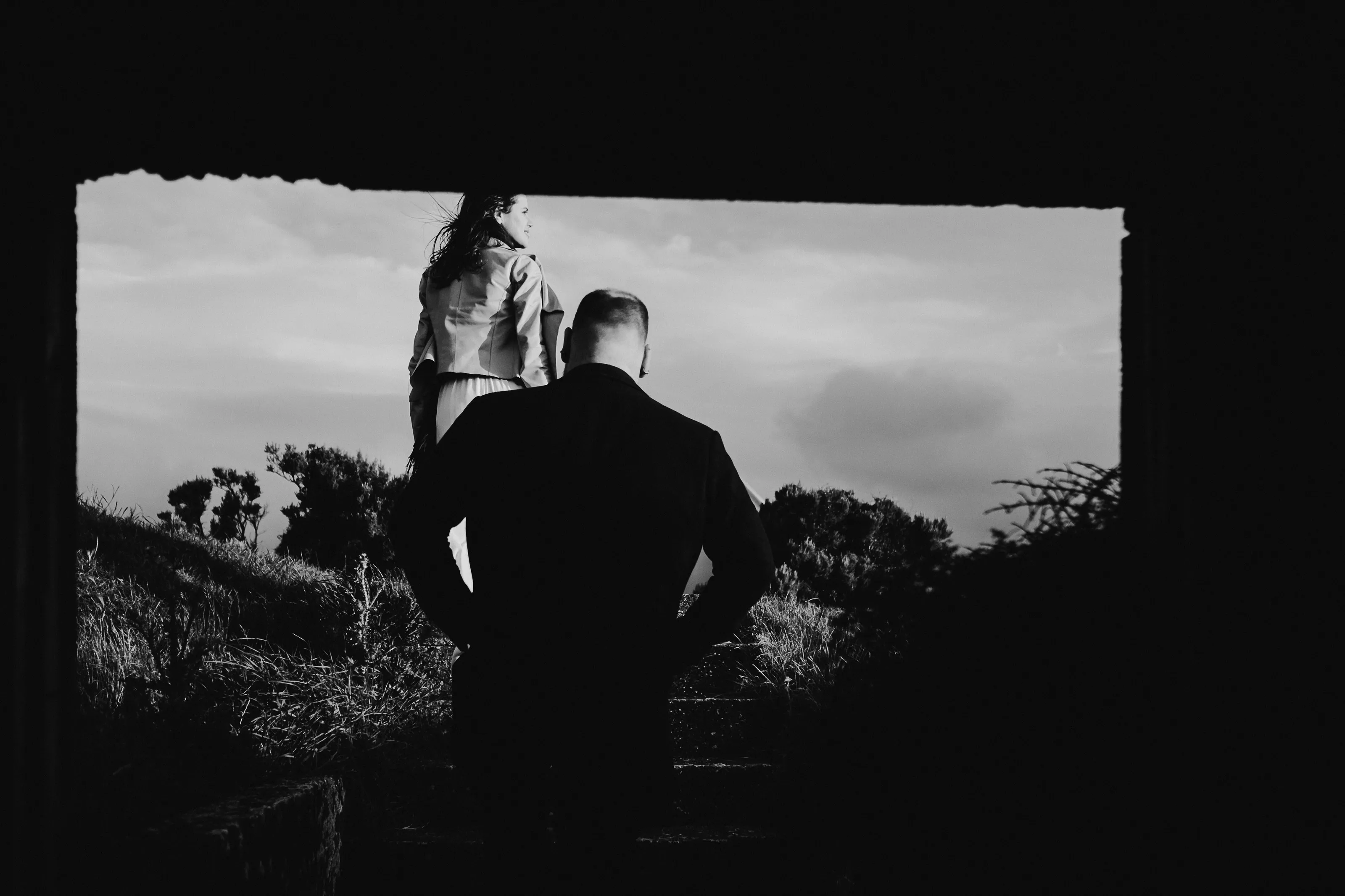 Couple embracing the wild Wellington weather during couple photoshoot