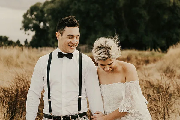 Rach and Cam laughing together on their wedding day.